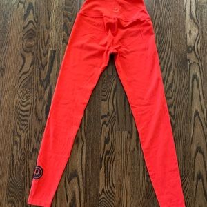 Pure Barre branded Beyond Yoga tights